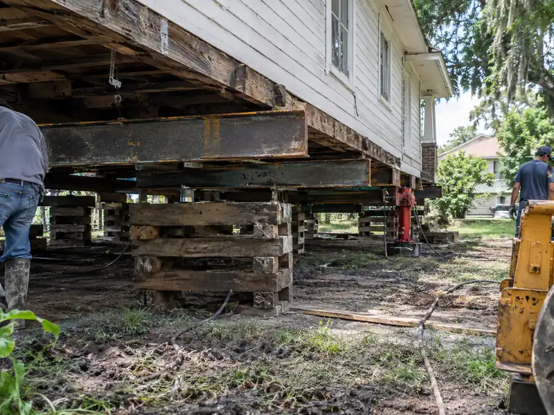 Steel lifting beams set under a raised home in the Baton Rouge area